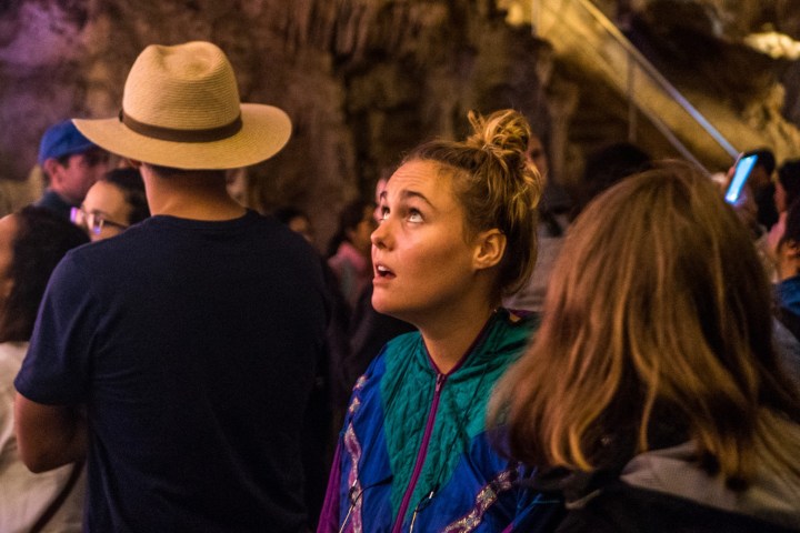 A girl mesmerised be what she sees inside the Jenolan Caves.