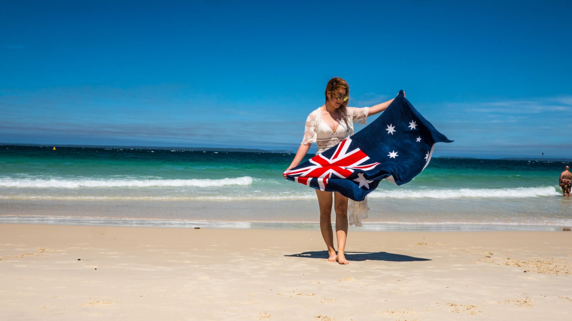 A woman posing with the Australian flag.