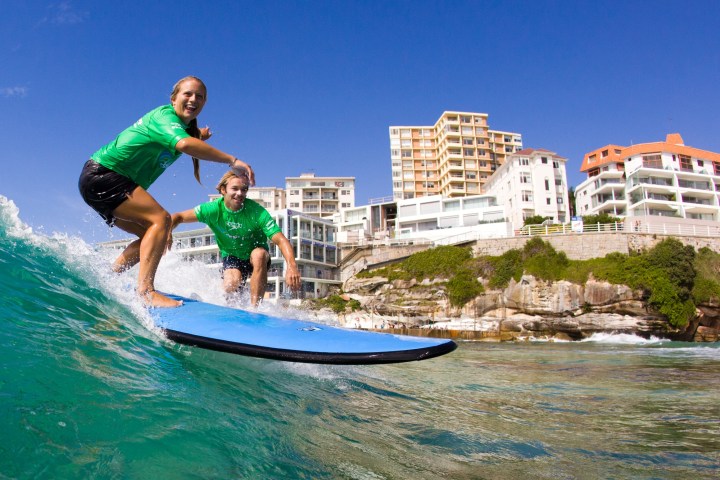 People surfing in Bondi Beach.