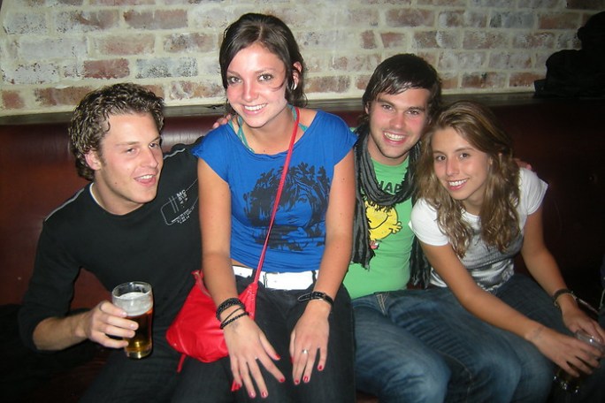A group of friends sharing a drink at the World Bar.
